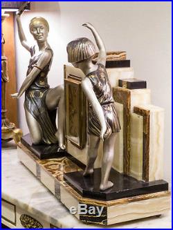 1930's FRENCH ART DECO MANTEL CLOCK WITH STATUE SCULPTURE BY P. SEGA. SIGNED