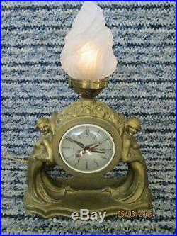 Antique Art Deco nude lady figural spelter clock with flame lamp vintage 1930's