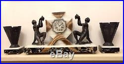 Art Deco Clock With A Pair Of Garnitures Sculpture By Limousin