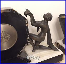 Art Deco Clock With A Pair Of Garnitures Sculpture By Limousin