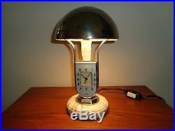 Art deco lamp with clock, and alarm. Mofem with chrome and marble base