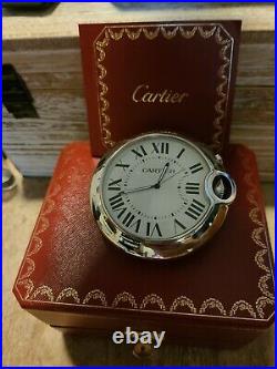 Cartier Travel Clock with alarm. Silver and has a large blue sapphire on dial