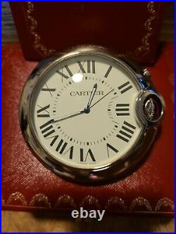 Cartier Travel Clock with alarm. Silver and has a large blue sapphire on dial