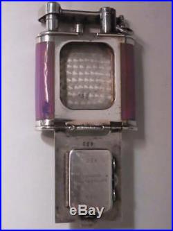 DUNHILL Oil Lighter with clock, enameled mother-of-pearl dial with art deco patt