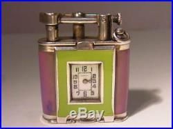 DUNHILL Oil Lighter with clock, enameled mother-of-pearl dial with art deco patt
