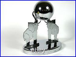 Exceptional art deco clock with a chromed globe supported by two elephants