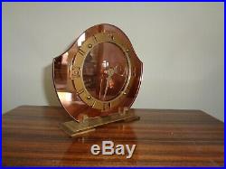 Peach mirrored art deco clock near perfect condition and keeps time