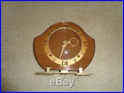 Peach mirrored art deco clock near perfect condition and keeps time