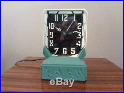 Rex Art products 1930s art deco lighted clock. Looks excellent and keeps time